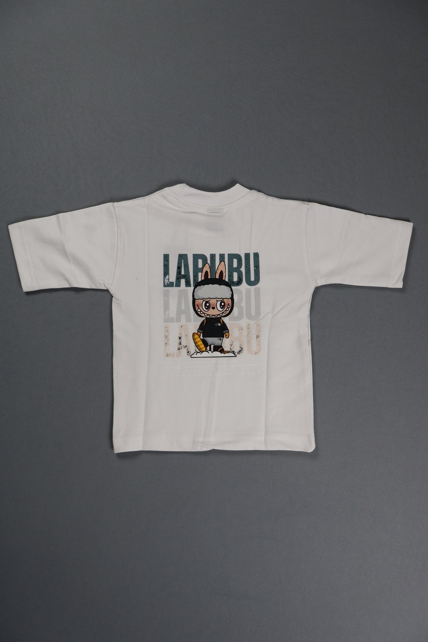 White t-shirt with graphic design on a gray background