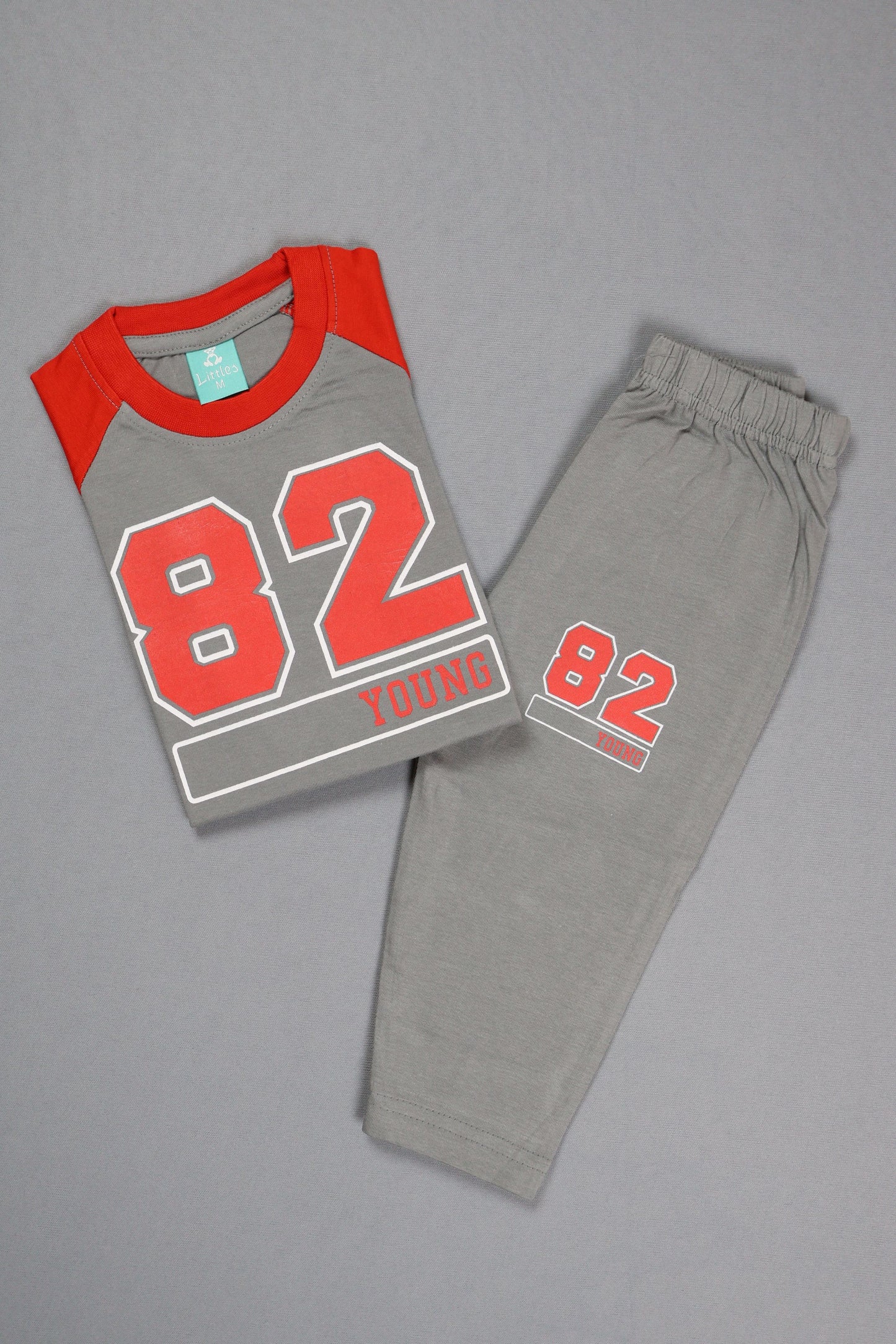 Gray sweatpants with red '82' print on a gray background