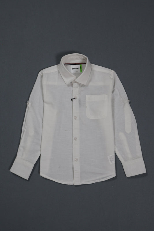 "A comprehensive product view of the Fyst boys' off-white casual button-down shirt. The main image showcases the premium cotton twill texture with a clean, front-facing profile featuring a single chest pocket and matching tonal buttons. Side-by-side thumbnails highlight the functional versatility of the garment, demonstrating both the full-length sleeves and the buttoned roll-up tab feature that allows for a relaxed, mid-arm style. The shirt is finished with a classic spread collar and a subtle curved hemli