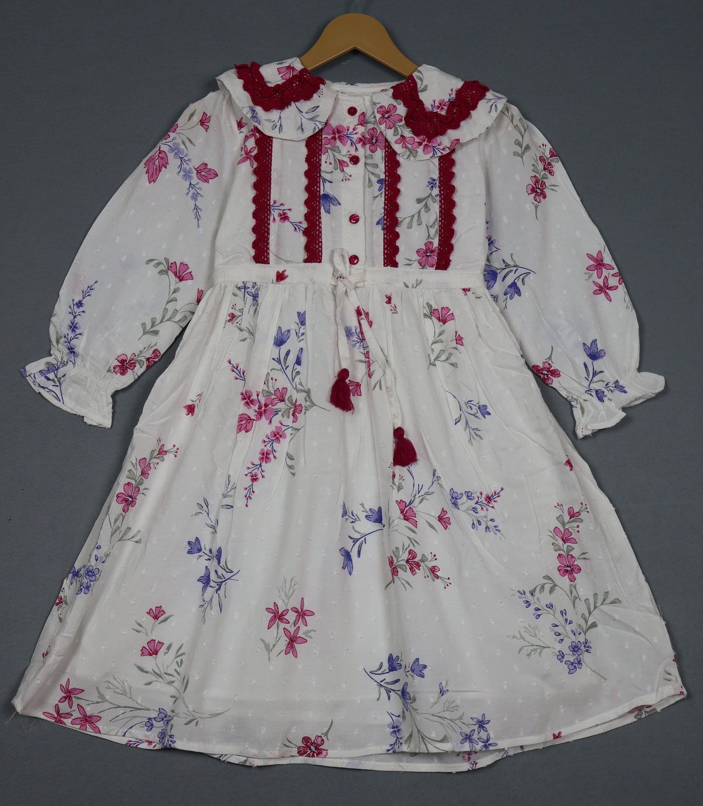 Girls long sleeve frock in pearl white with pink and purple floral print and lace detailing