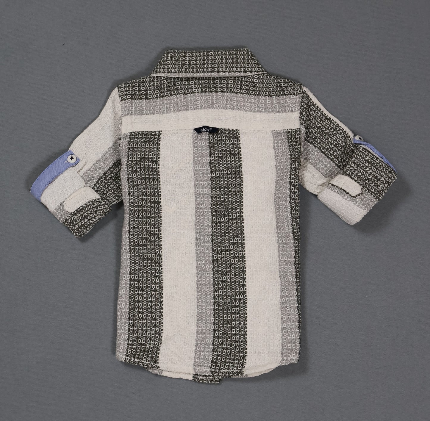 Striped shirt with a pattern on a gray background