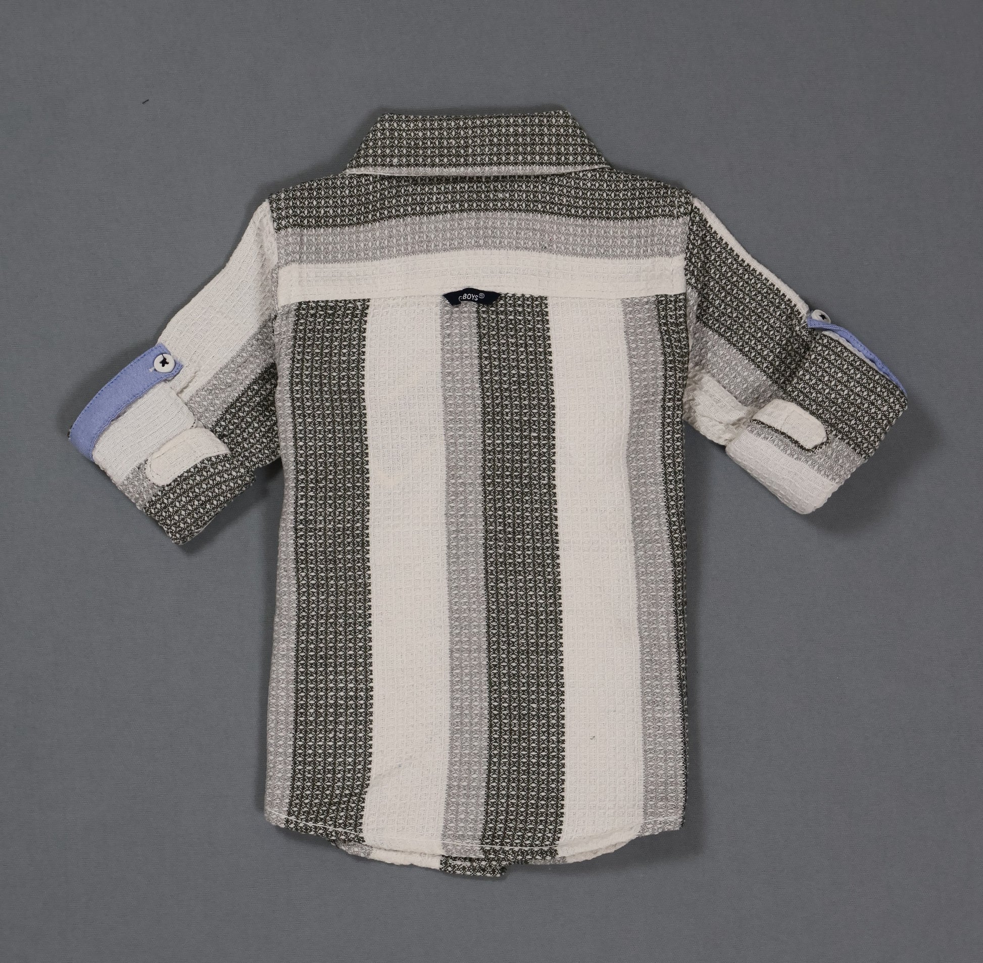 Striped shirt with a pattern on a gray background
