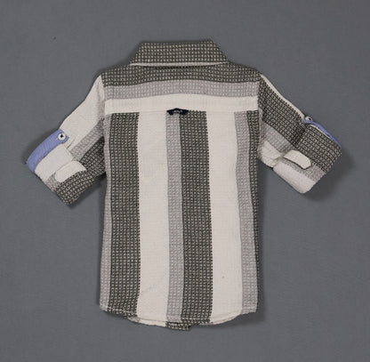 Striped shirt with a pattern on a gray background