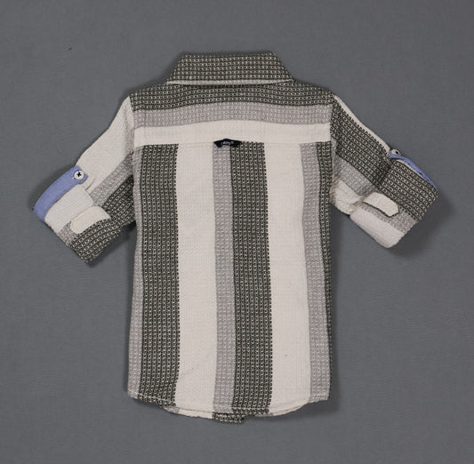 Striped shirt with a pattern on a gray background