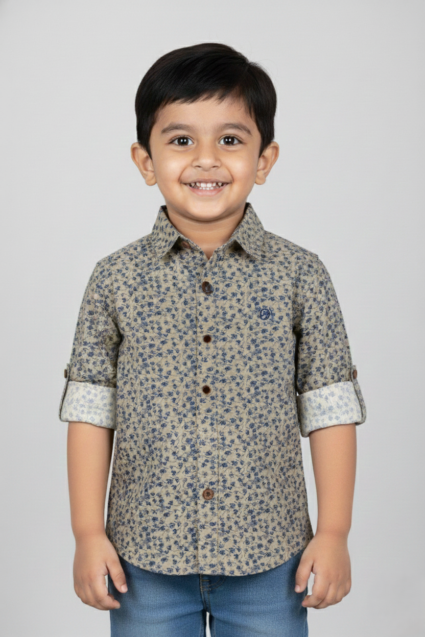 Fyst Boys' Sage Green Long-Sleeve Button-Down Shirt with All-Over Navy Blue Floral Ditsy Print and Roll-Up Sleeve Tabs, worn by smiling child.