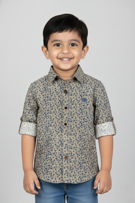Fyst Boys' Sage Green Long-Sleeve Button-Down Shirt with All-Over Navy Blue Floral Ditsy Print and Roll-Up Sleeve Tabs, worn by smiling child.