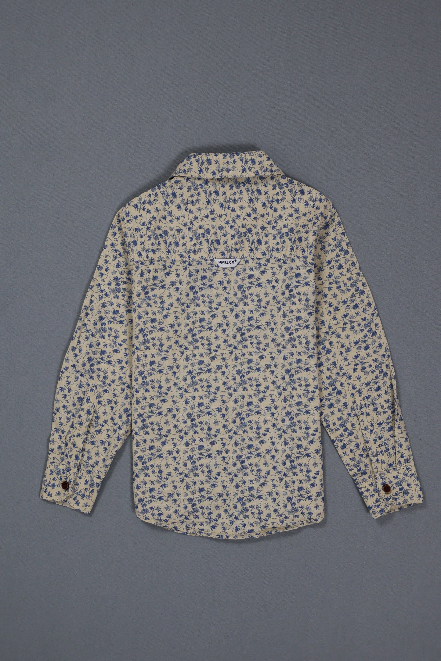 Floral-patterned shirt on a gray background