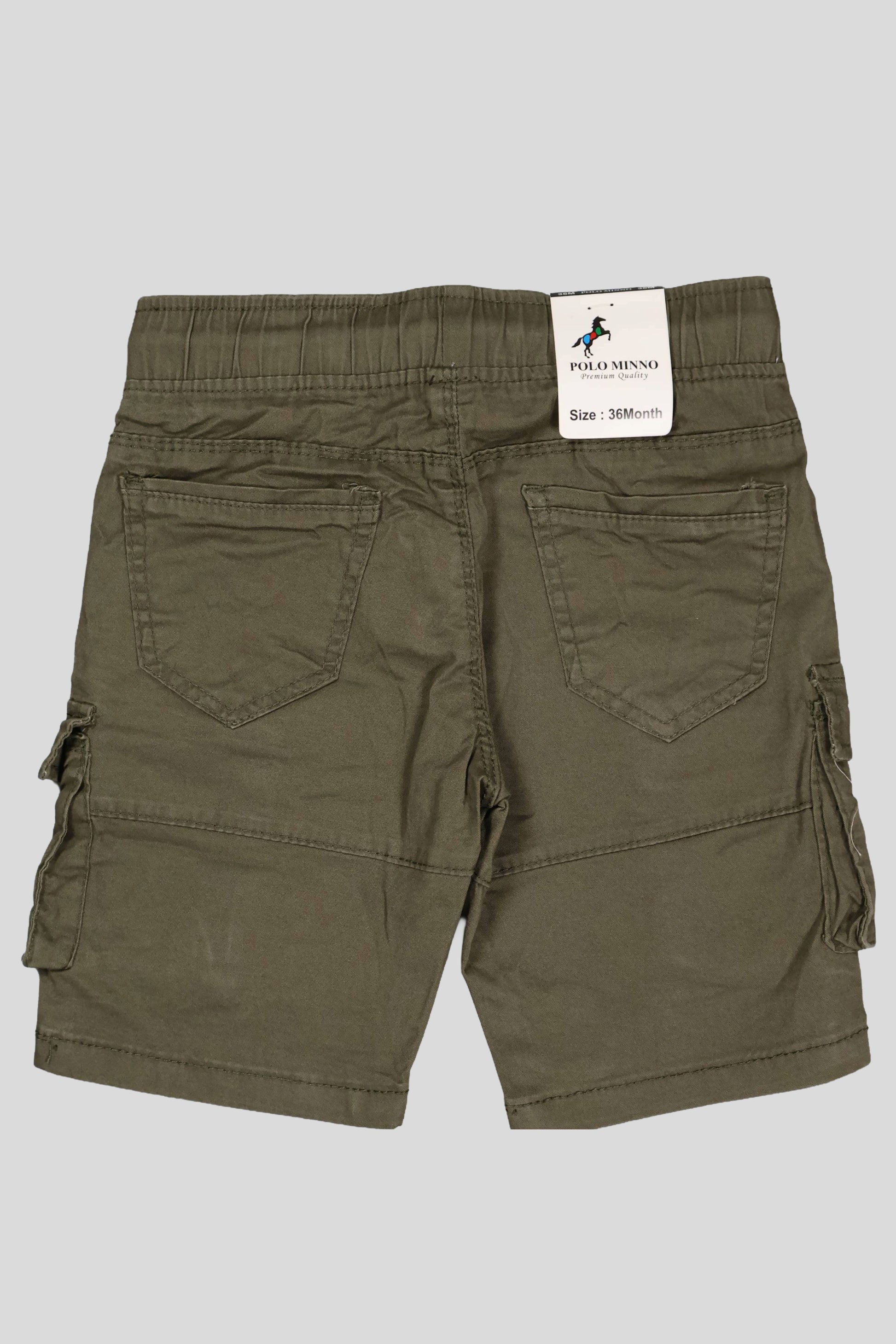 Green cargo shorts with a brand label on a gray background