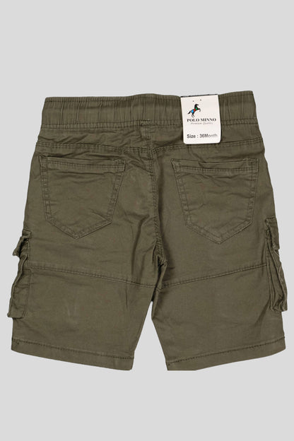 Green cargo shorts with a brand label on a gray background
