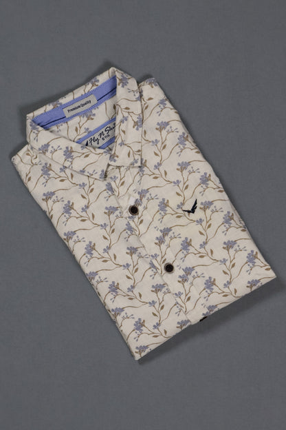 Folded shirt with floral pattern on a gray background