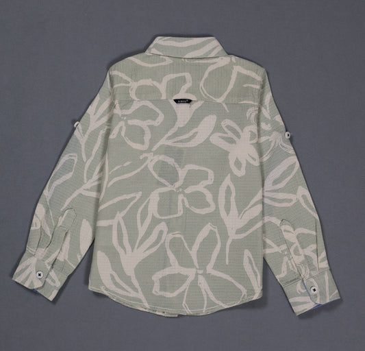 Green floral patterned shirt on a gray background