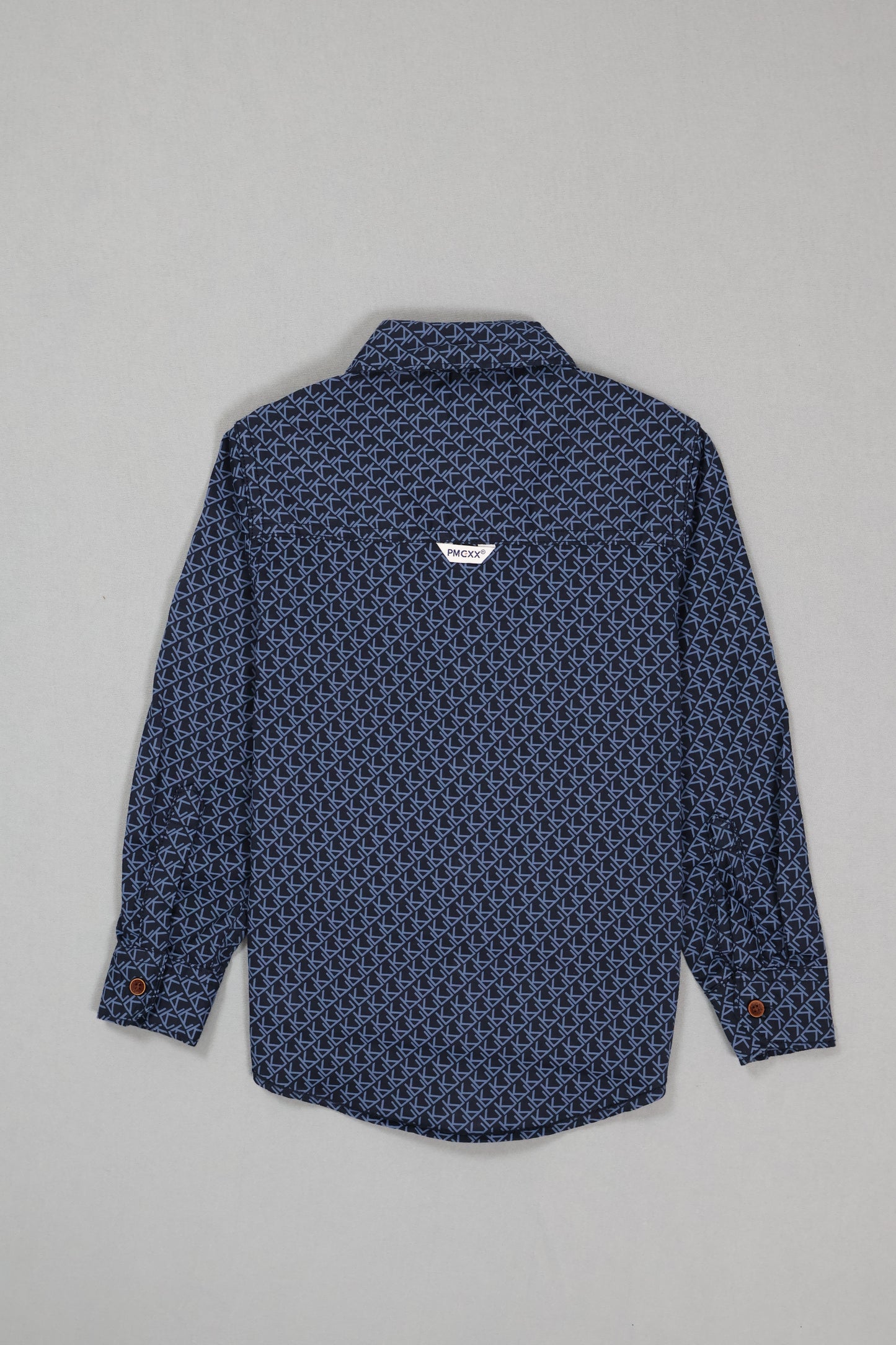Blue patterned shirt on a gray background
