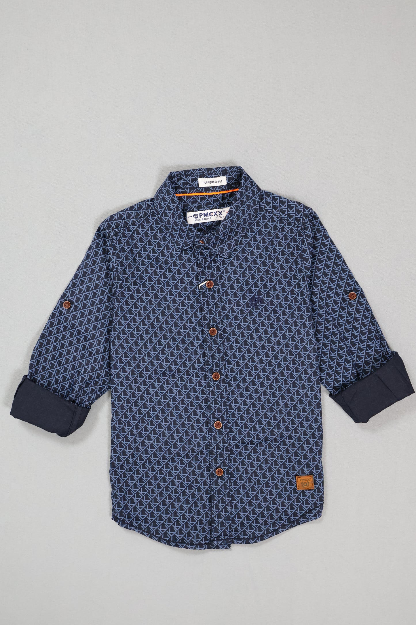 Blue patterned shirt with buttons on a light gray background