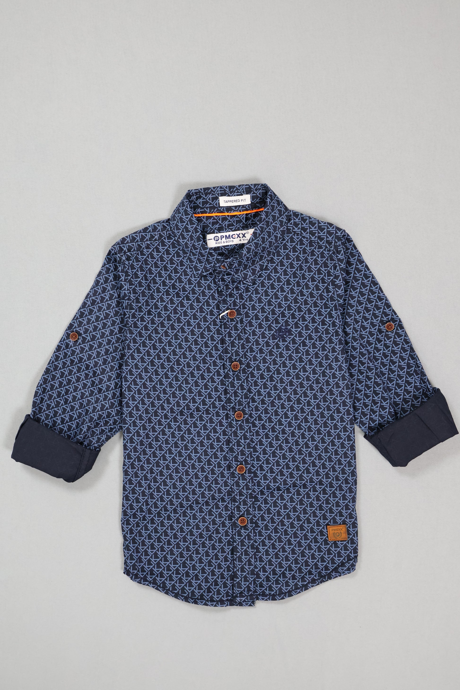 Blue patterned shirt with buttons on a light gray background