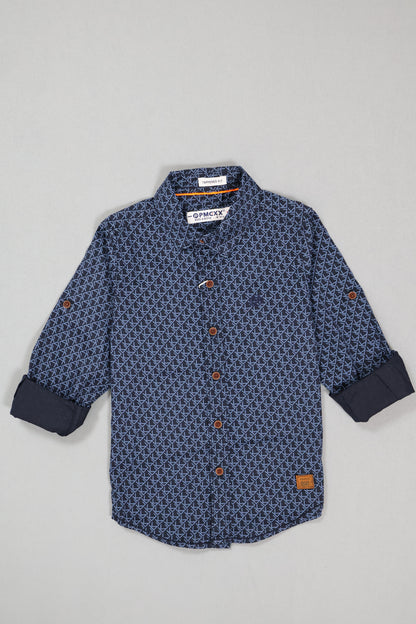 Blue patterned shirt with buttons on a light gray background