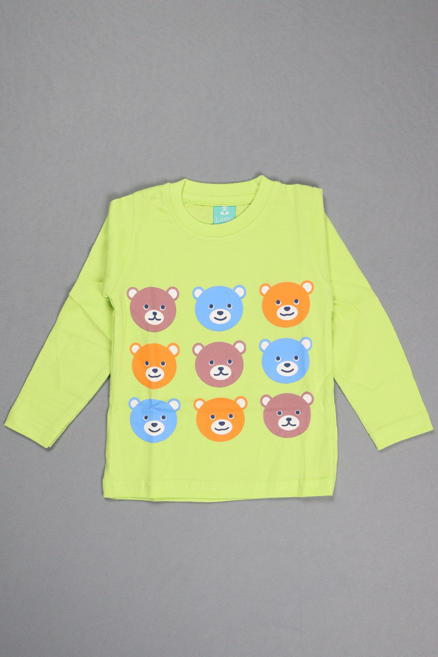 Green long-sleeve shirt with colorful bear patterns on a gray background