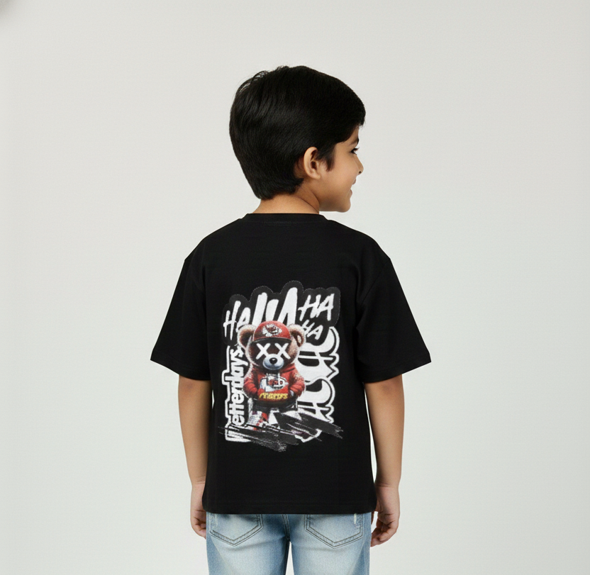 Child wearing a black t-shirt with graphic design on the back against a plain background