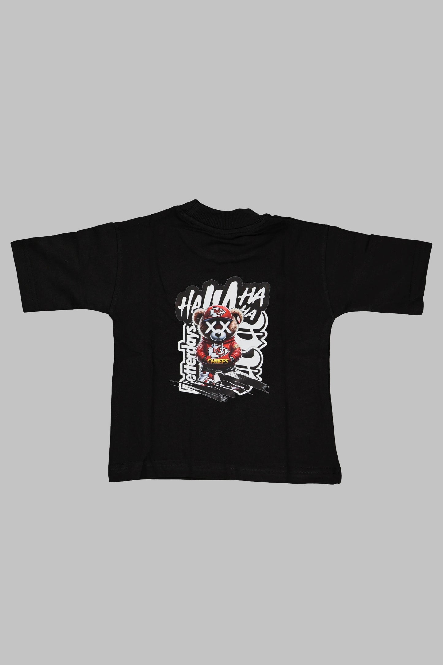Black t-shirt with graphic design on a gray background