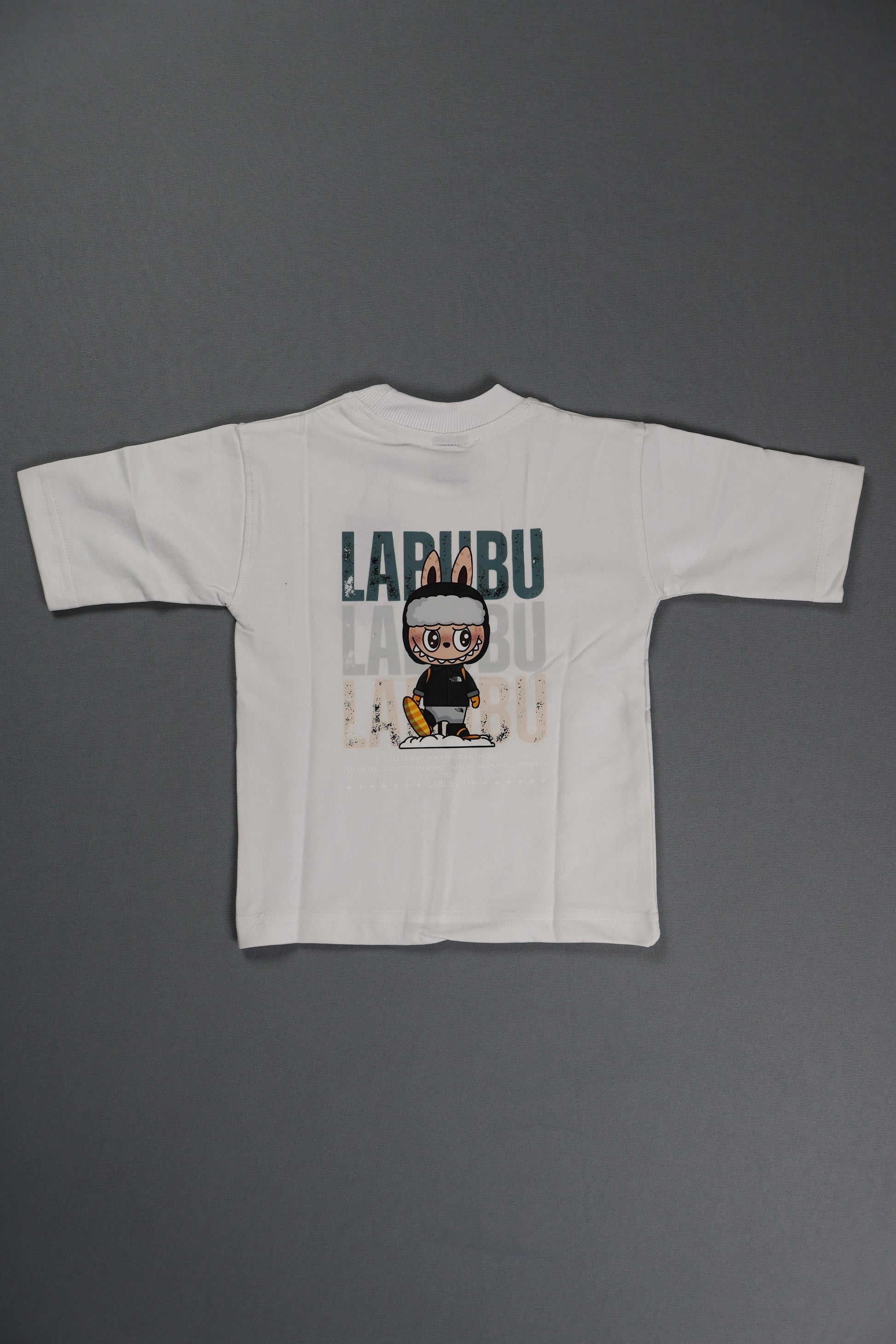 White t-shirt with graphic design on a gray background