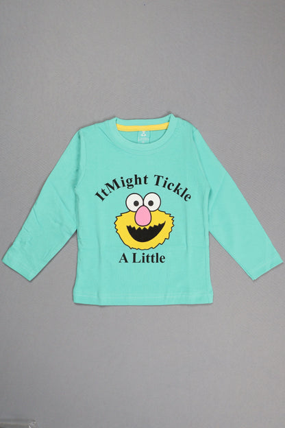 Light blue long-sleeve shirt with a cartoon character and text on a gray background