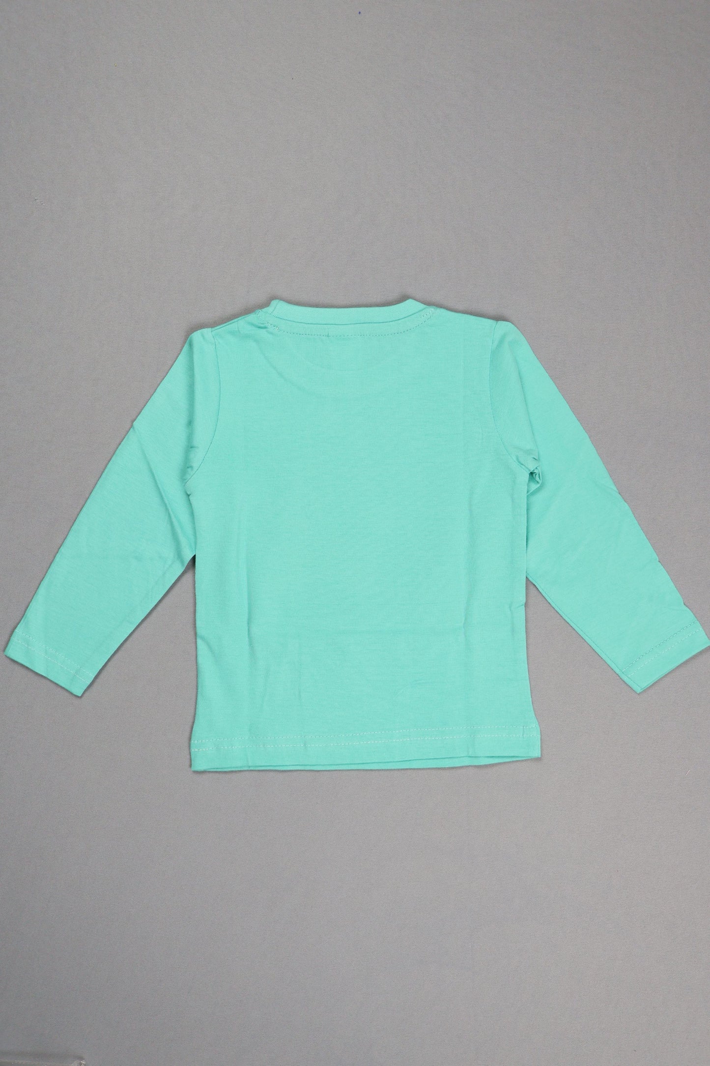 Light blue long-sleeve shirt on a gray background