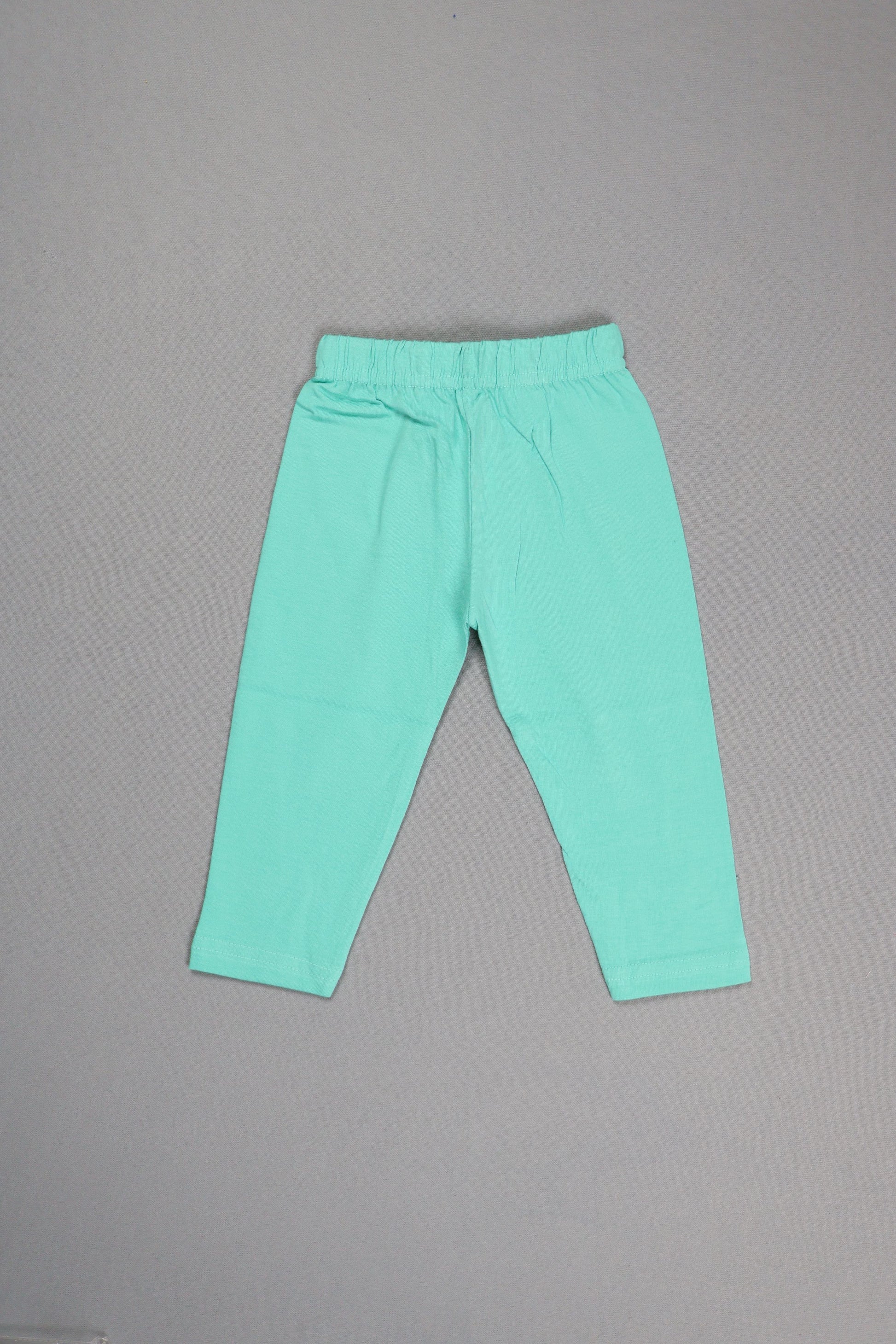 Light blue leggings on a gray background