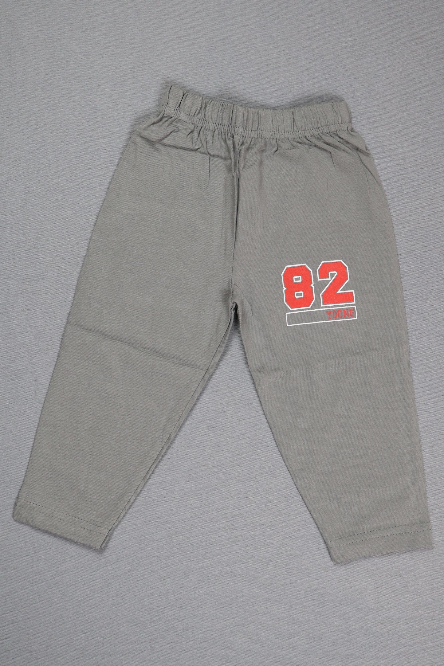 Gray sweatpants with red and white text on a gray background