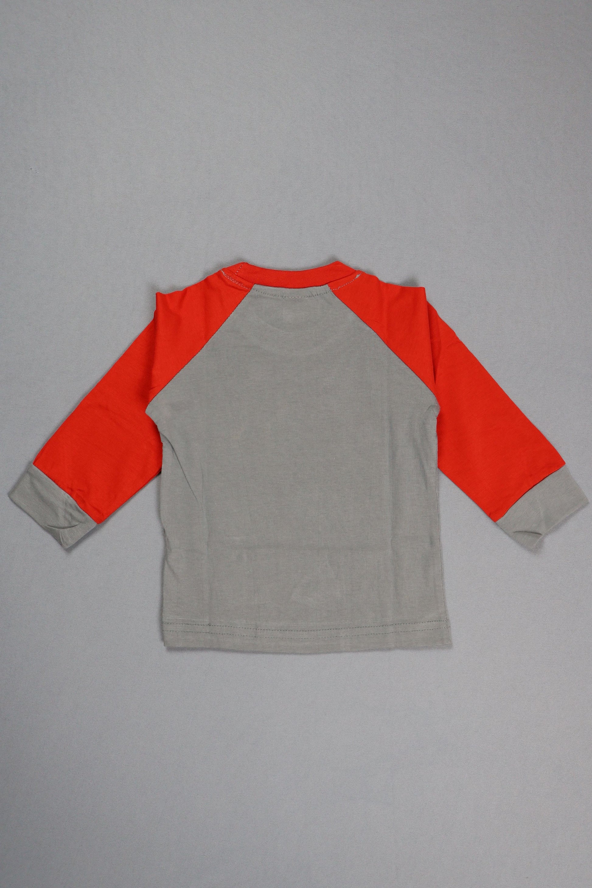Gray and red long-sleeve shirt on a gray background