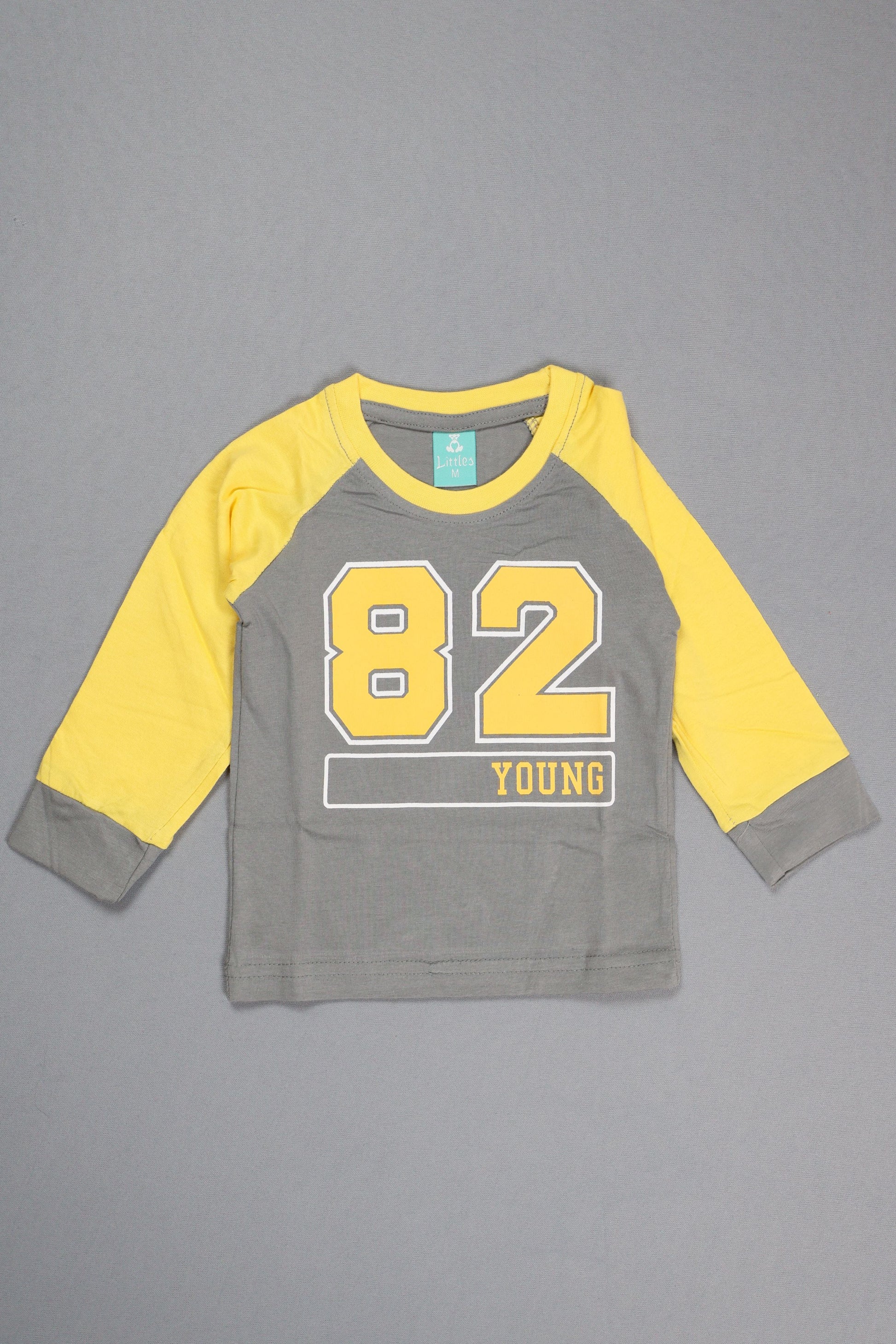 Gray and yellow long-sleeve shirt with number design on a gray background