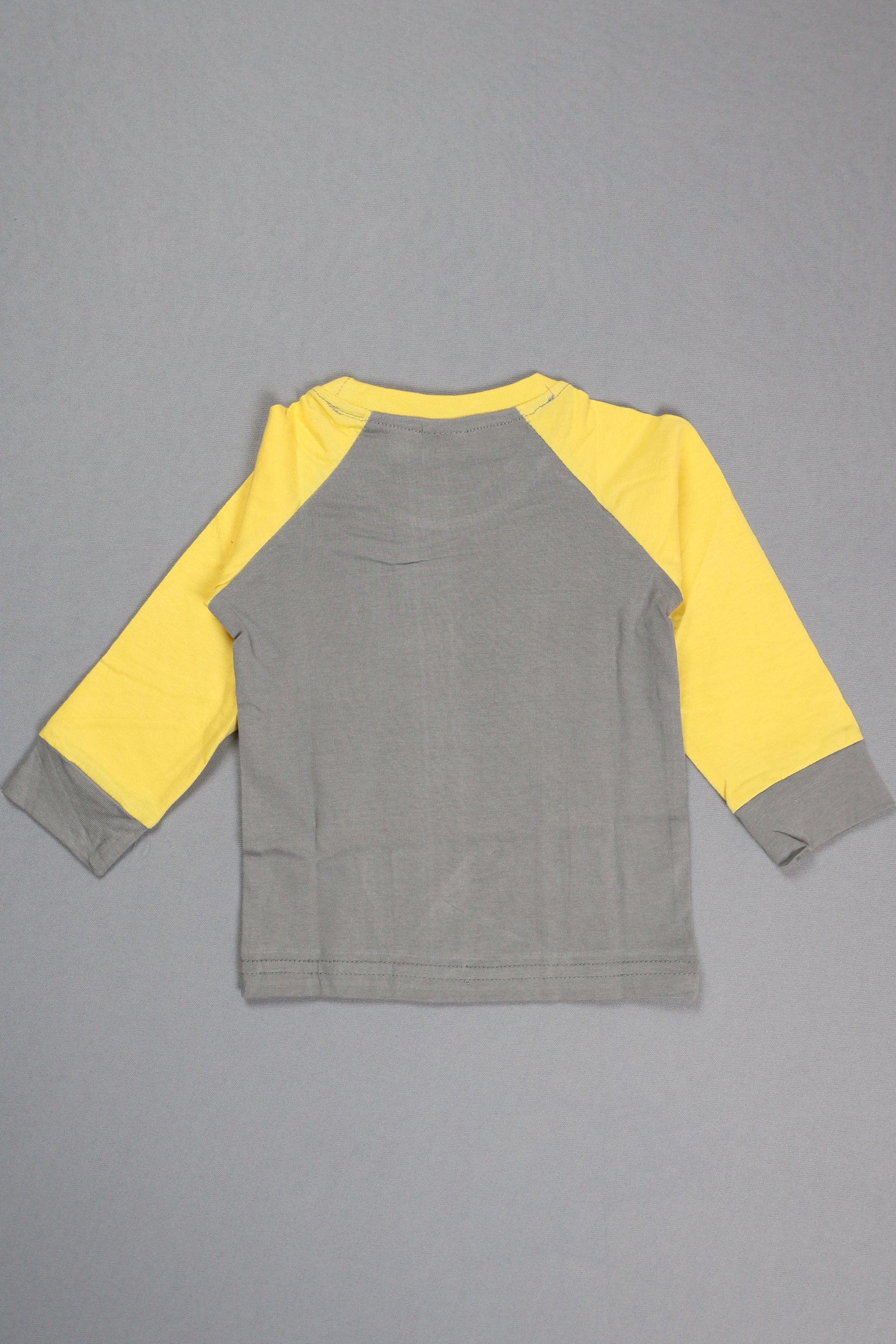 Gray and yellow long-sleeve shirt on a gray background