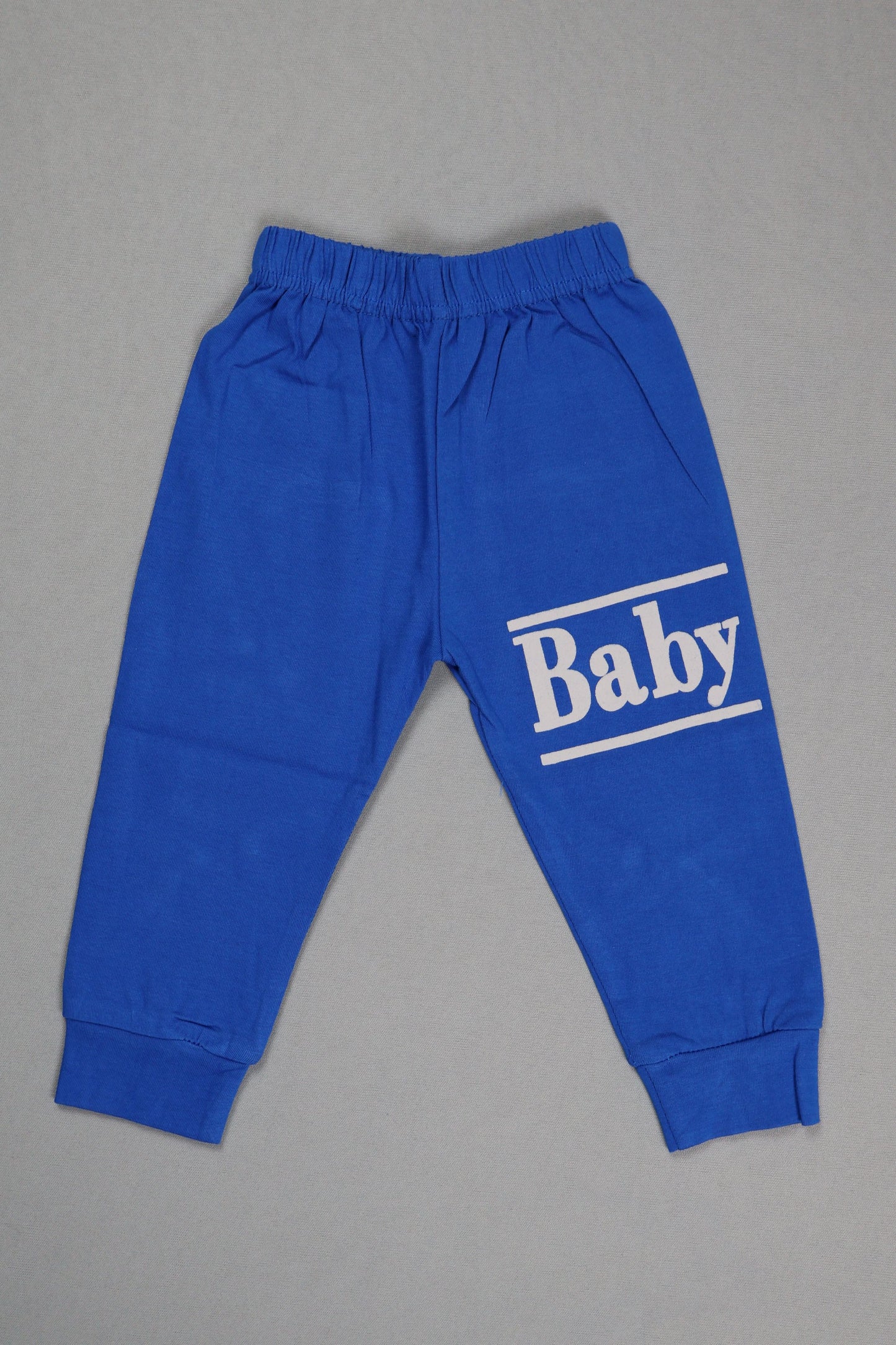Blue baby pants with 'Baby' print on a gray background