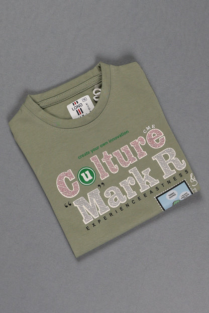 Green t-shirt with text and graphics on a gray background