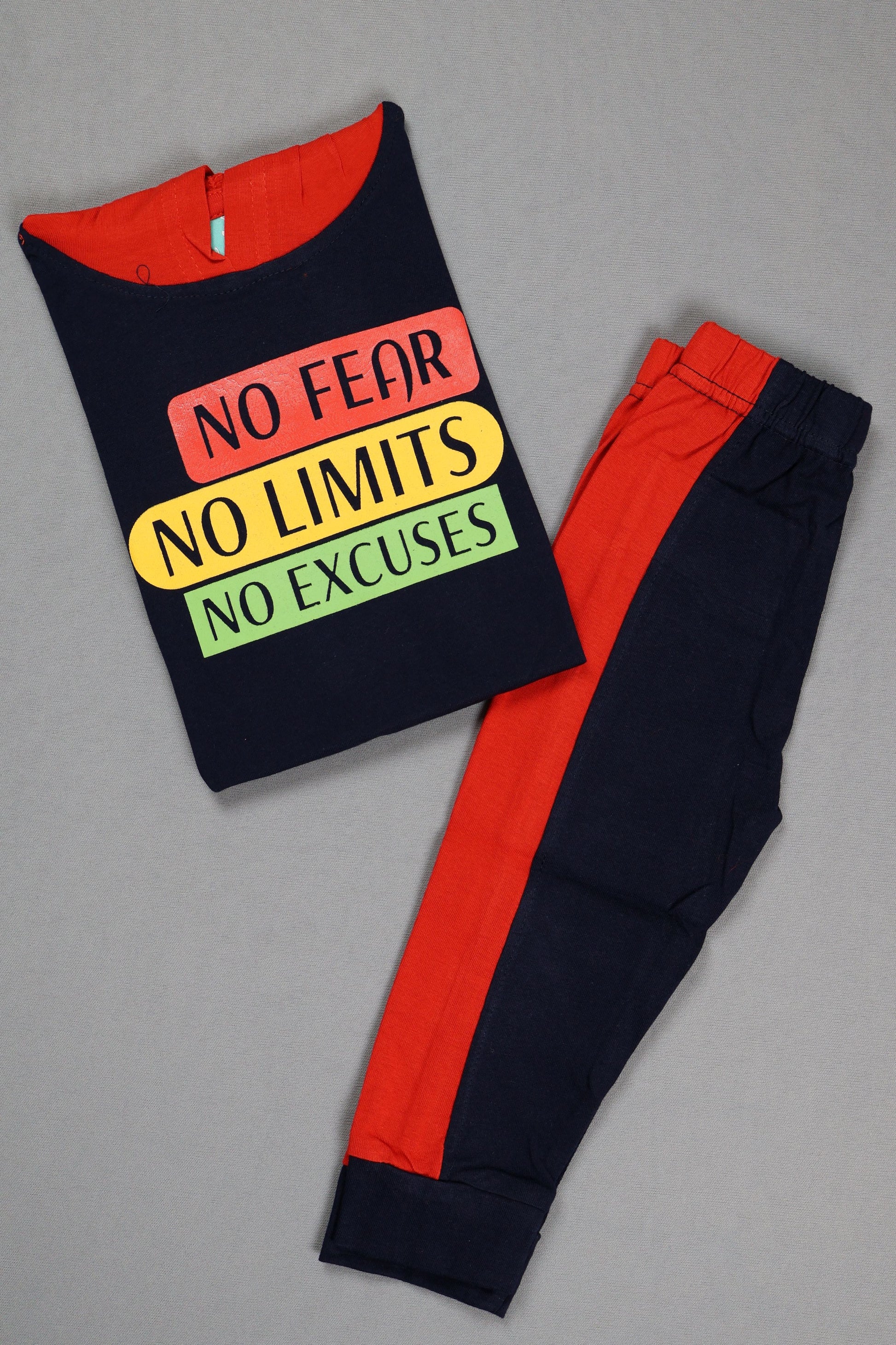 Black t-shirt with colorful text and red pants on a gray background