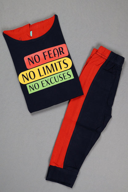 Black t-shirt with colorful text and red pants on a gray background