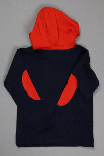 Navy blue fabric with red circular patterns on a gray background
