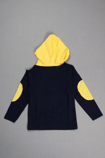 Black outfit with yellow circular patterns on a gray background