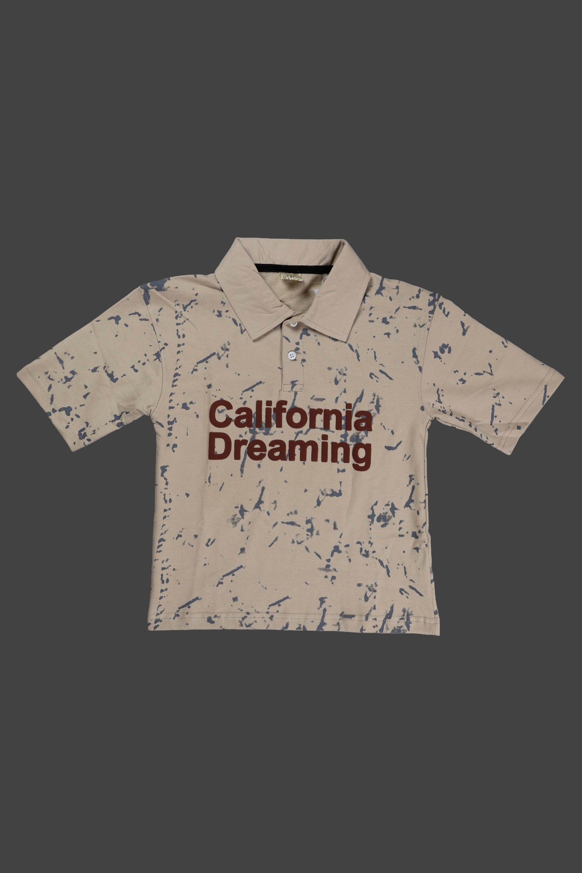 Beige polo shirt with 'California Dreaming' text on a dark background