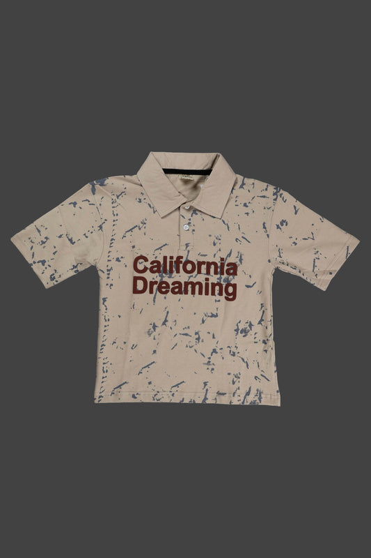 Beige polo shirt with 'California Dreaming' text on a dark background