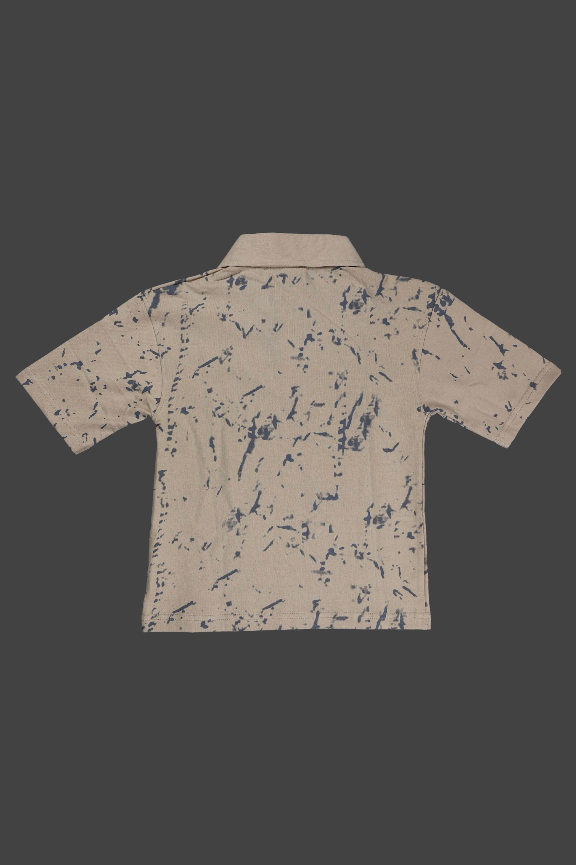 Beige shirt with blue abstract pattern on a black background