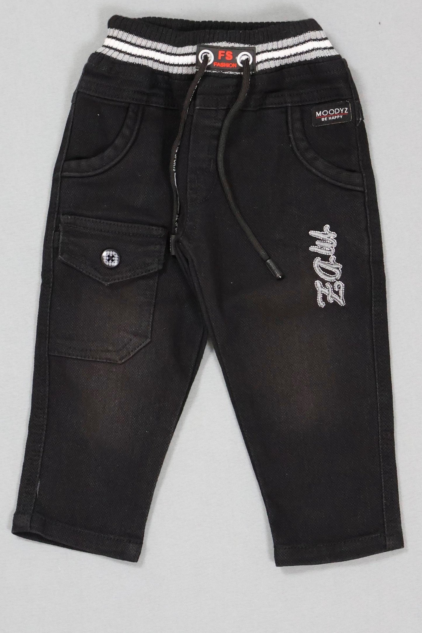 Black pants with white embroidery on a gray background