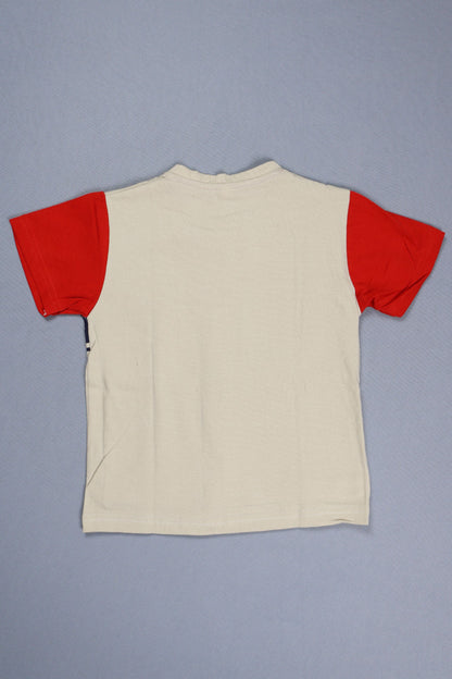 Beige garment with red trim on a gray background