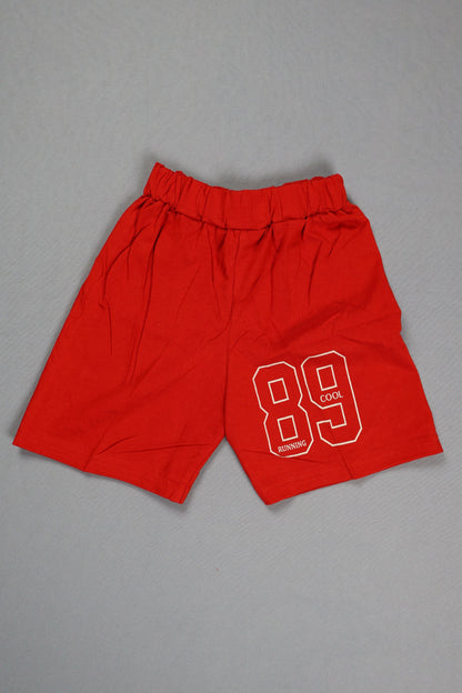 Red shorts with a white logo on a gray background