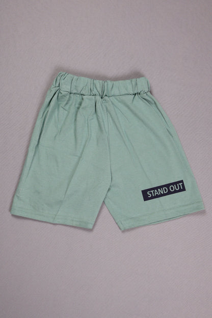 Light green shorts with a 'STAND OUT' label on a gray background