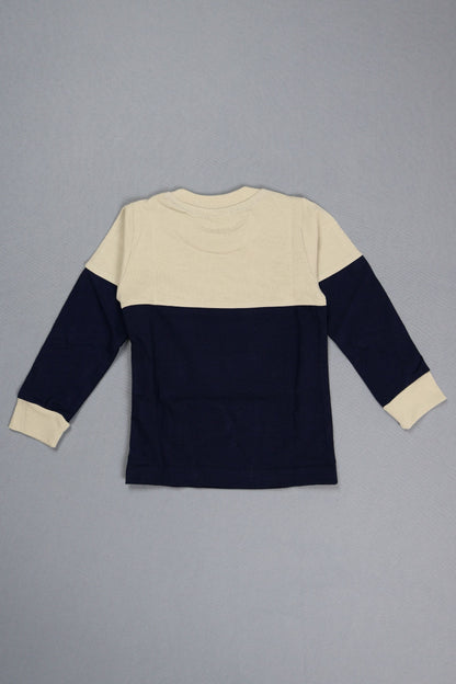 Navy and beige sweater on a gray background