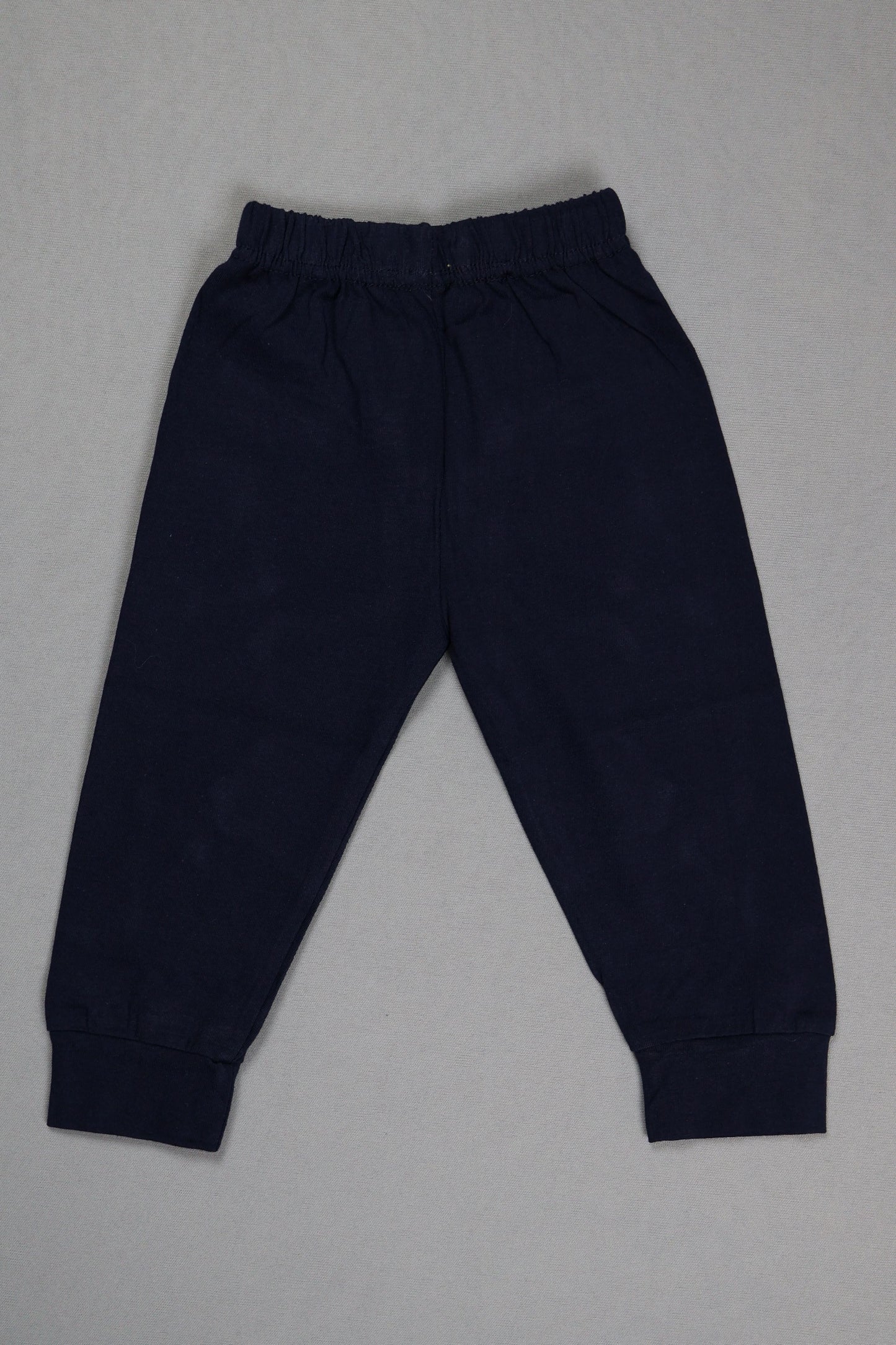 Navy blue pants on a gray background