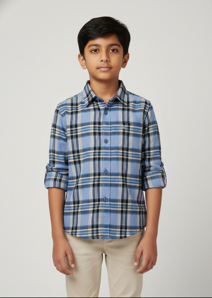 Boy in powder blue cotton checkered shirt with nautical grid pattern, long sleeves, beige pants