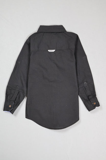 Folded black shirt on a light gray background
