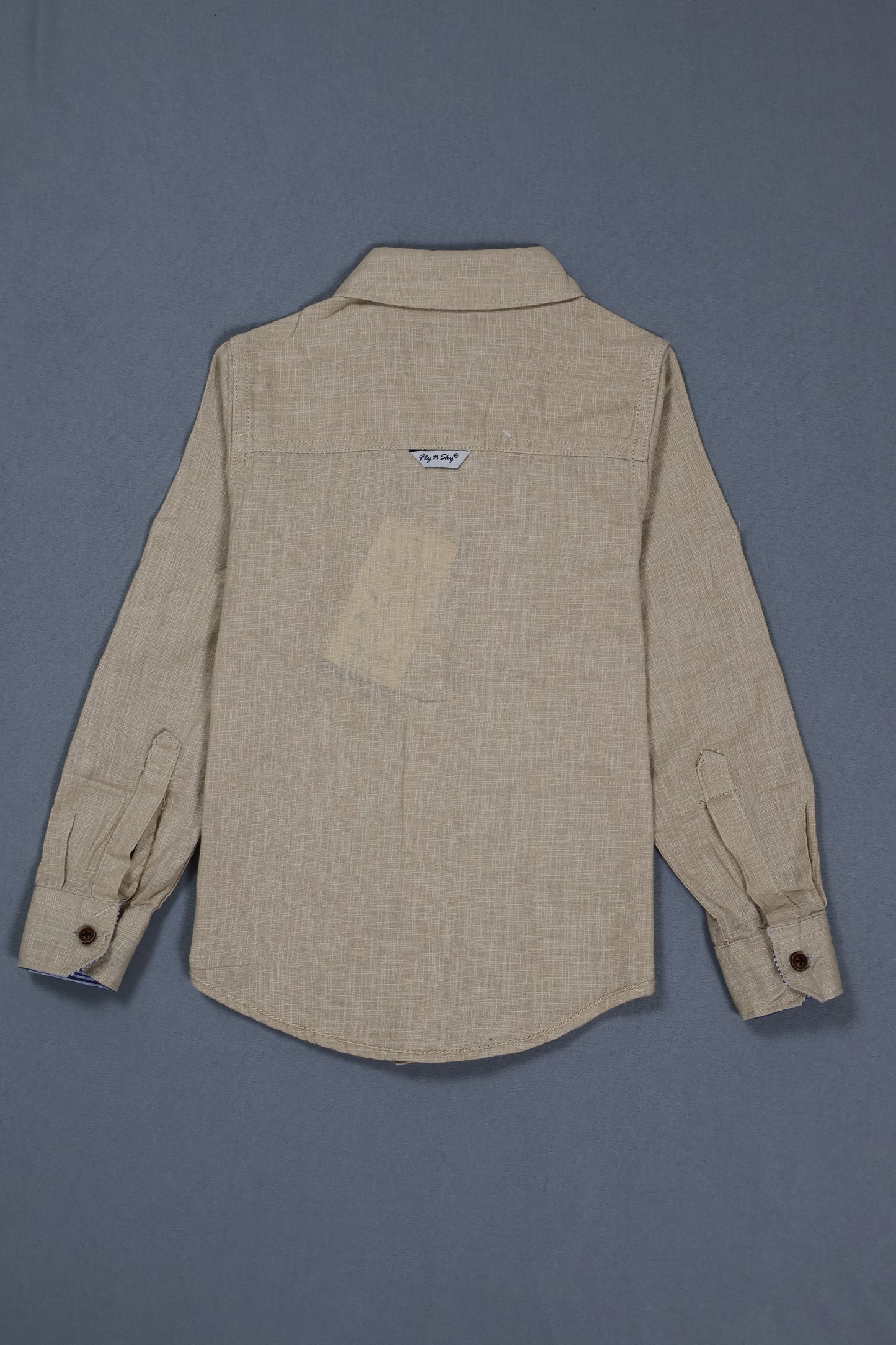 Beige shirt with a pocket on a gray background