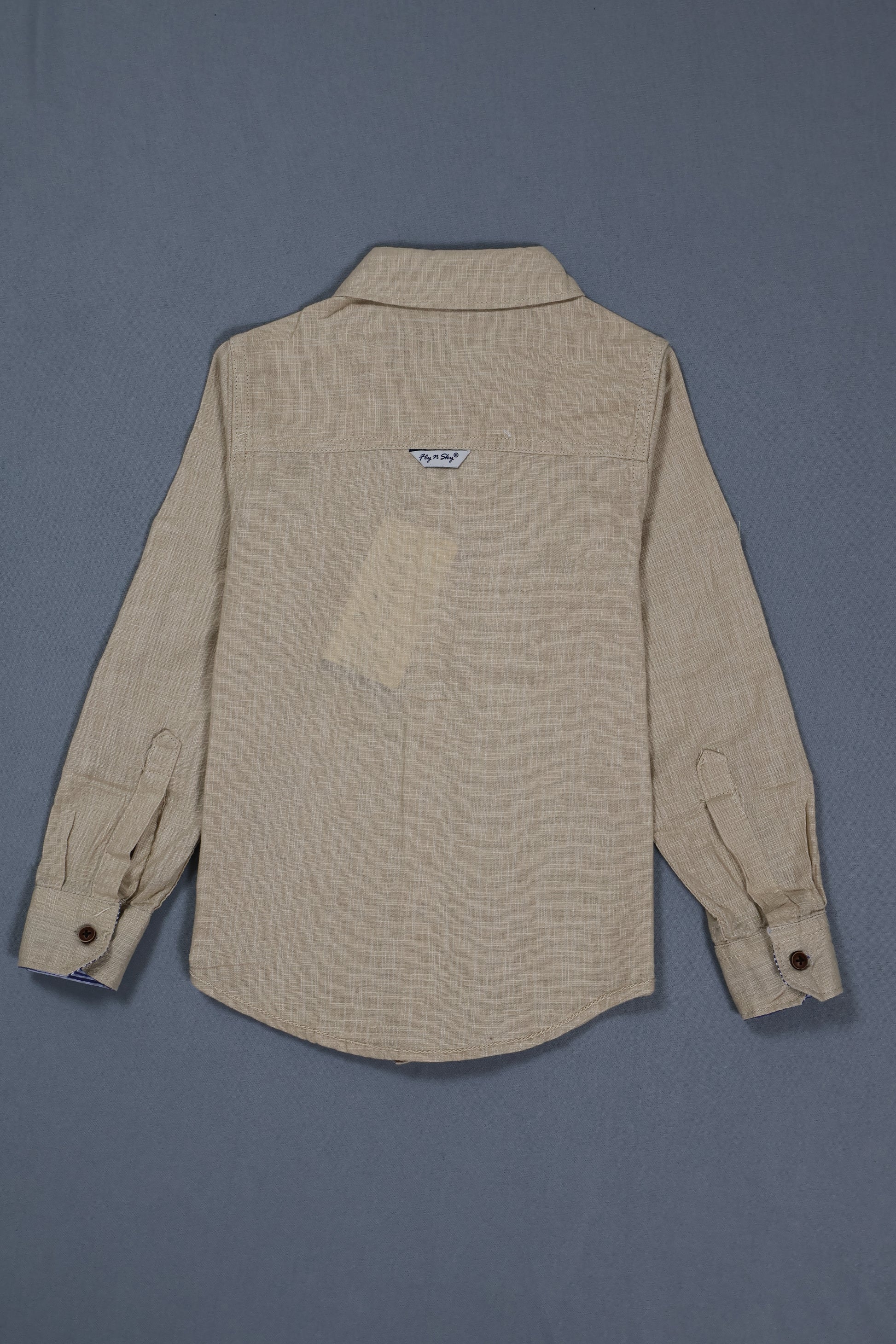 Beige shirt with a pocket on a gray background