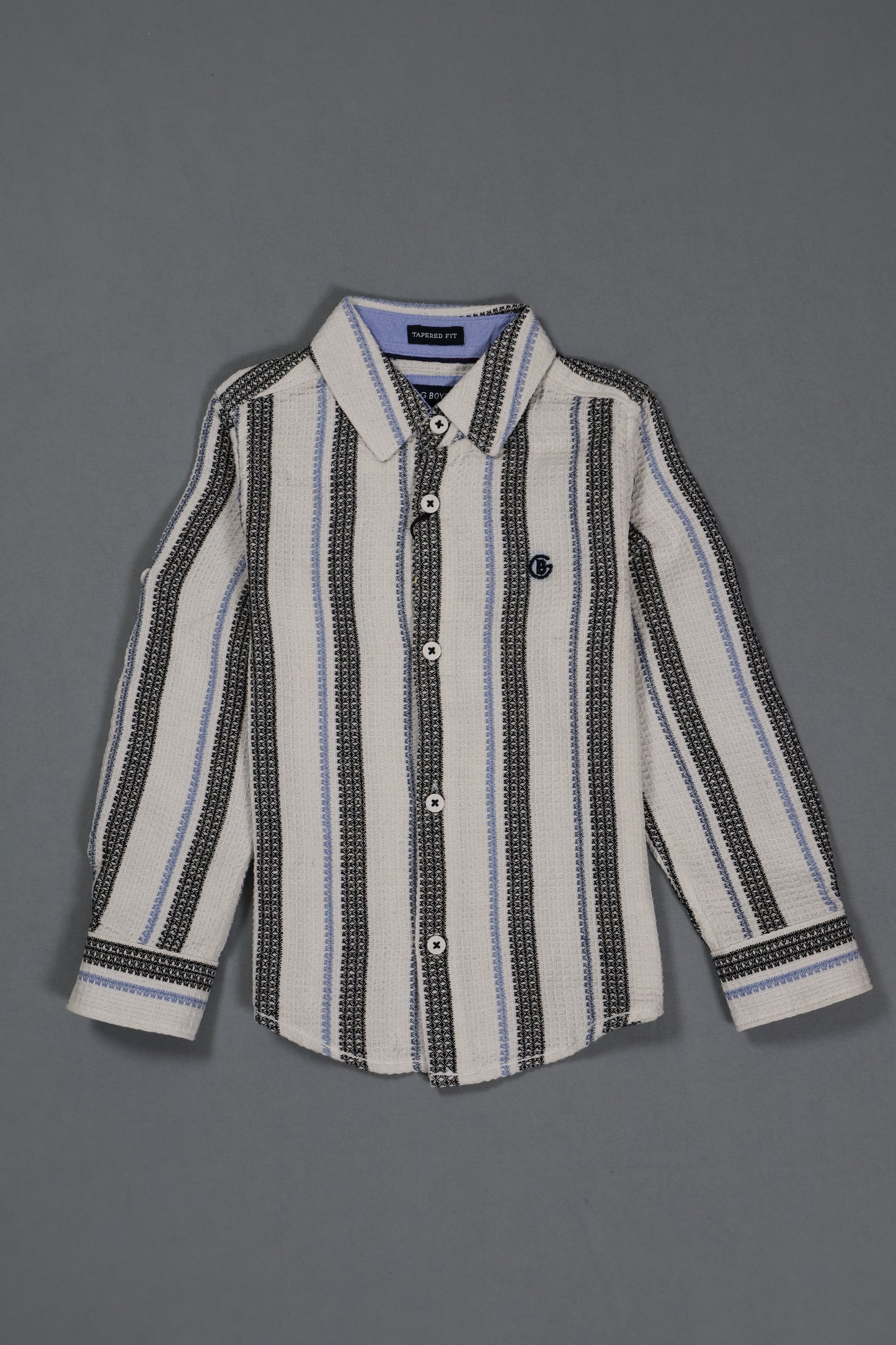 Striped shirt with black and white pattern on a gray background